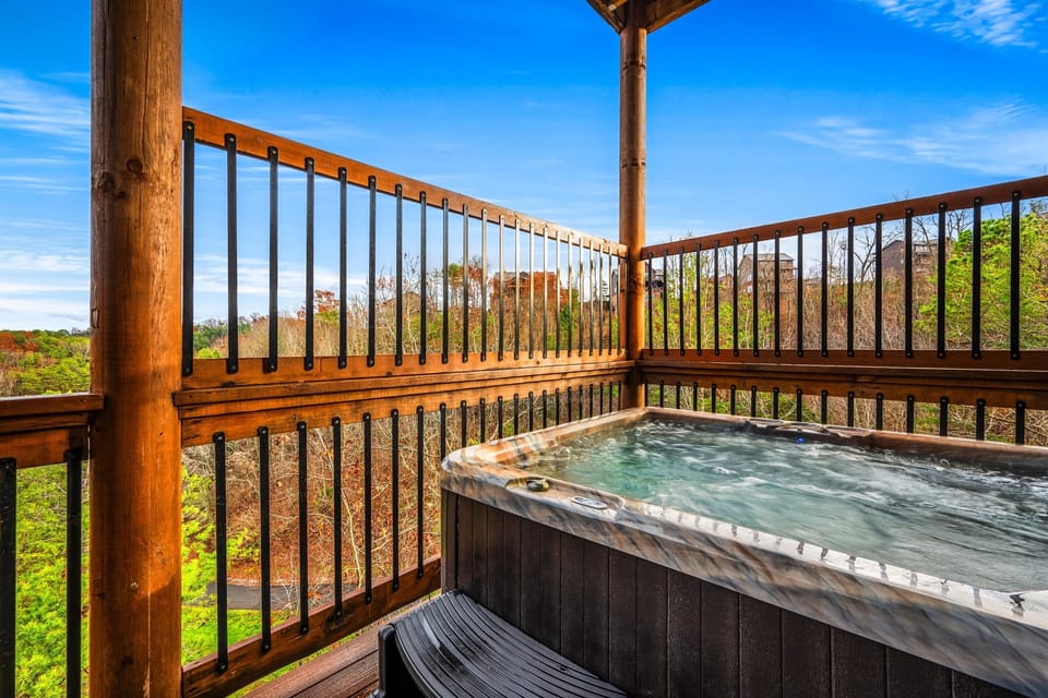 Relax in the hot tub and enjoy the mountain view 