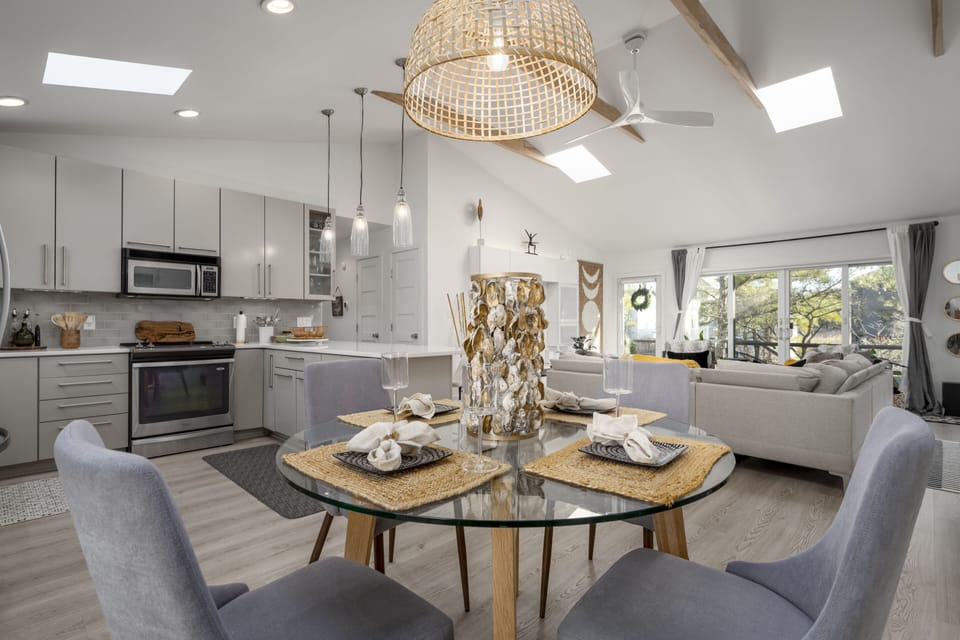 Open floor plan view of dining, kitchen and living room.