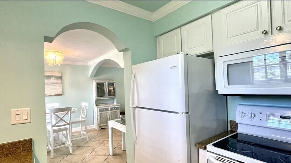 Cozy kitchen with full size refrigerator