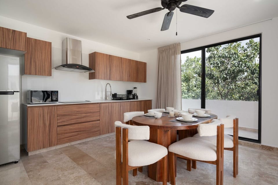 Create culinary masterpieces in our chic wood-themed kitchen and gather around the inviting dining area for delightful meals