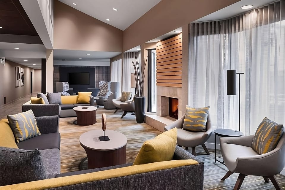 Sink into plush seating by the glowing lobby fireplace.