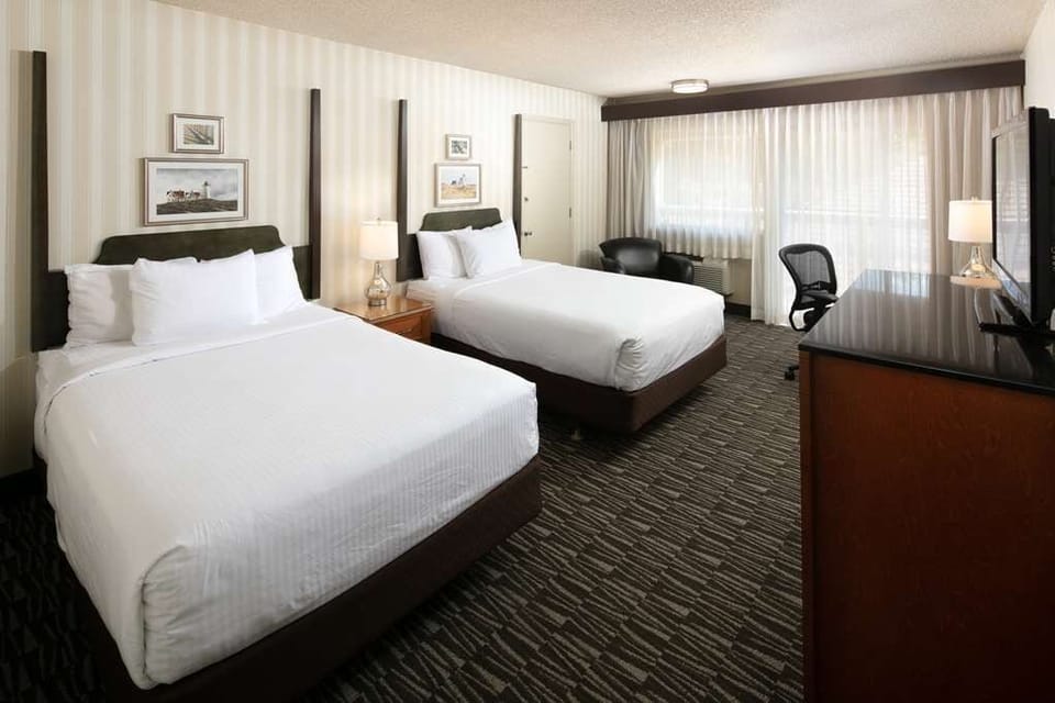 Settle in with plush linens and a calm, airy layout.