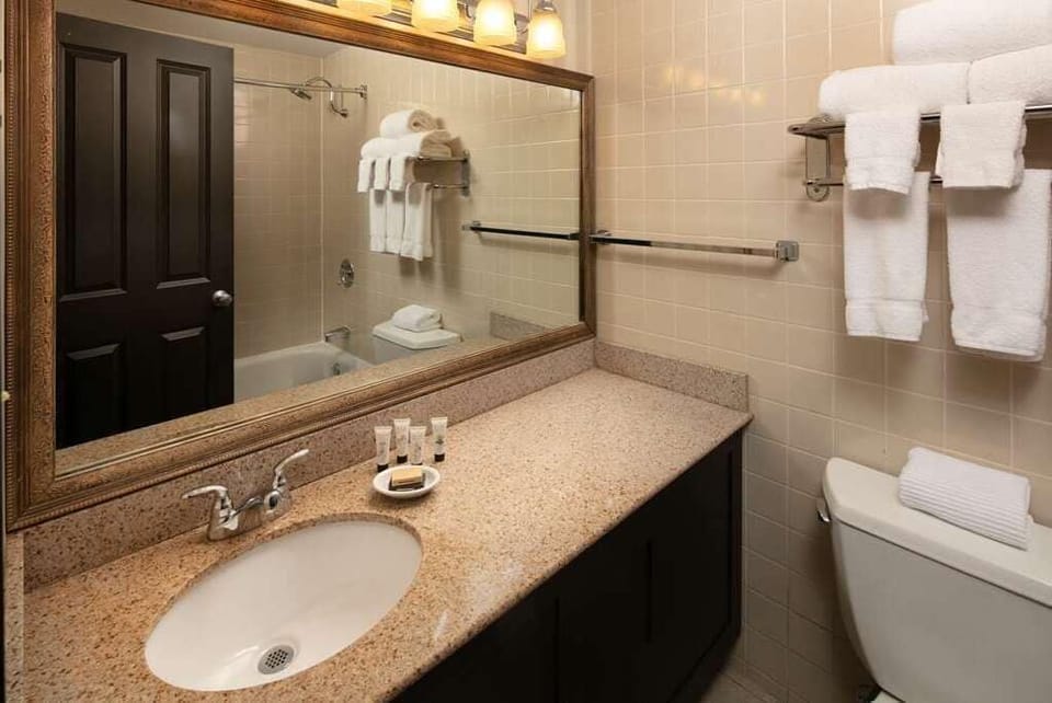 Refresh easily with a spotless vanity and fluffy towels.