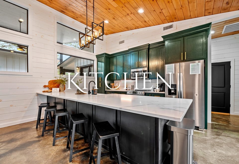 Gather around for great conversation and delicious meals in this spacious kitchen, complete with a modern touch.