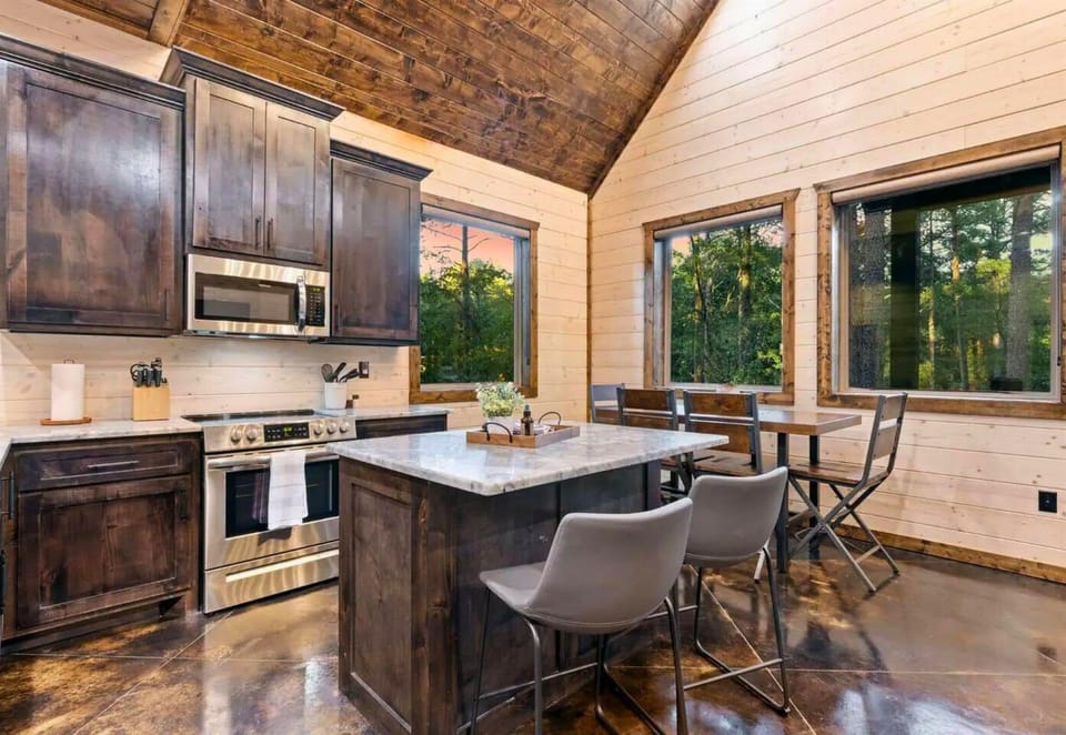 Bright and airy—start your morning with breakfast in this sunlit kitchen.