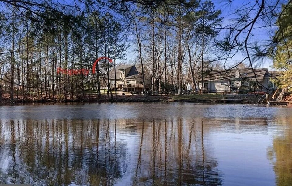 Back of house from other side of pond.