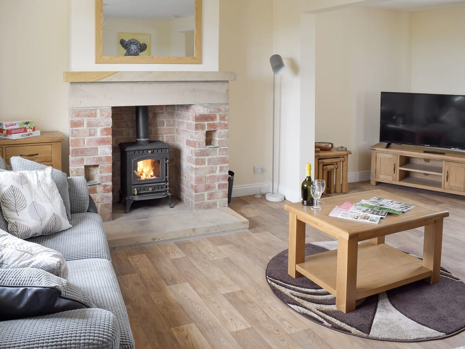 Spacious living room with wood burner | Rudda Farm House - Rudda Farm Cottages, Staintondale, near Whitby