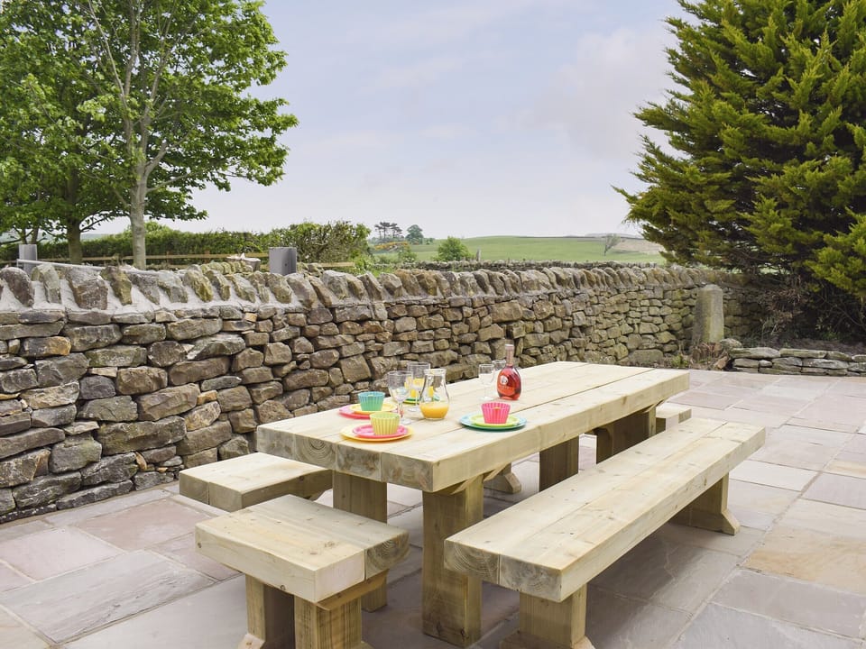 Paved patio area with outdoor furniture | Rudda Farm House - Rudda Farm Cottages, Staintondale, near Whitby
