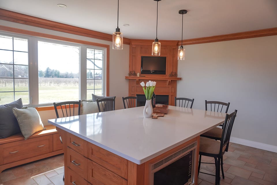 Spacious eat in kitchen offers plenty of seating and views of the vineyards