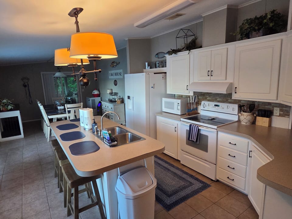 Cook for the family! Kitchen features an oven, fridge, and dishwasher.