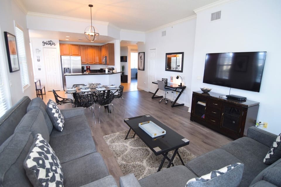 Open-plan living space, Smart TV, dining area, office space, kitchen with nook