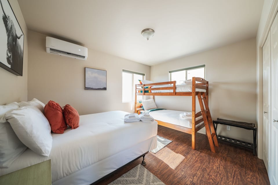 Secondary bedroom with full bed and queen bunks. 