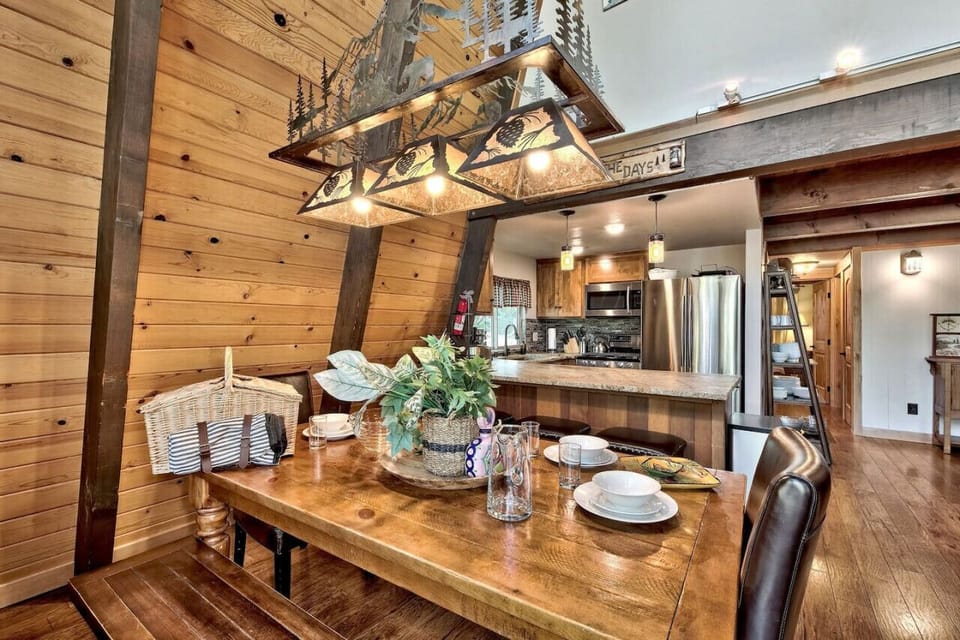 Dining table on main / mid level (seats 8).  There’s also bar seating for 3 and another small table that seats 4 adjacent to living area.