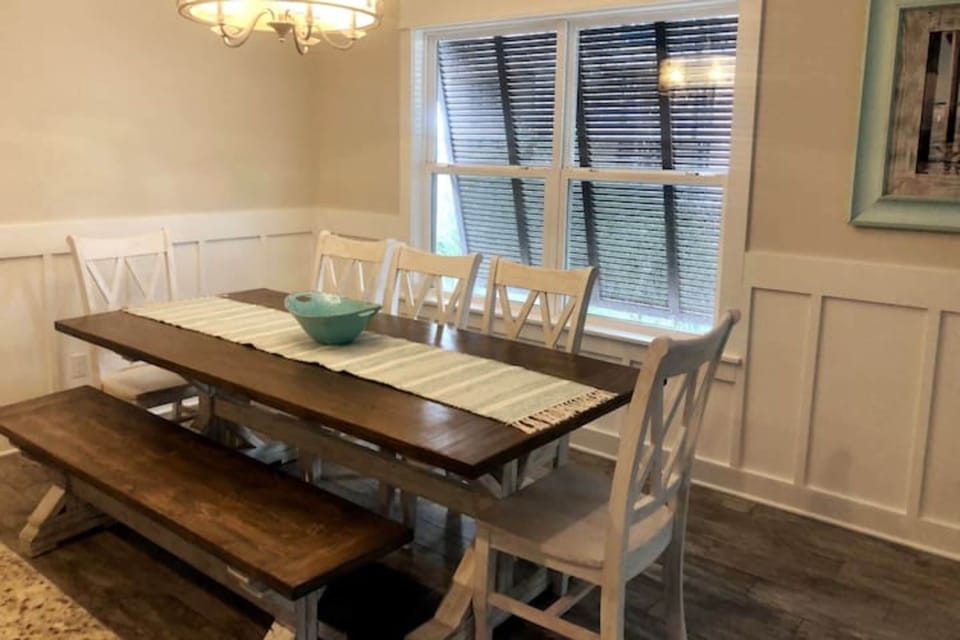 Dining table that seats eight comfortably. Breakfast bar seats four.