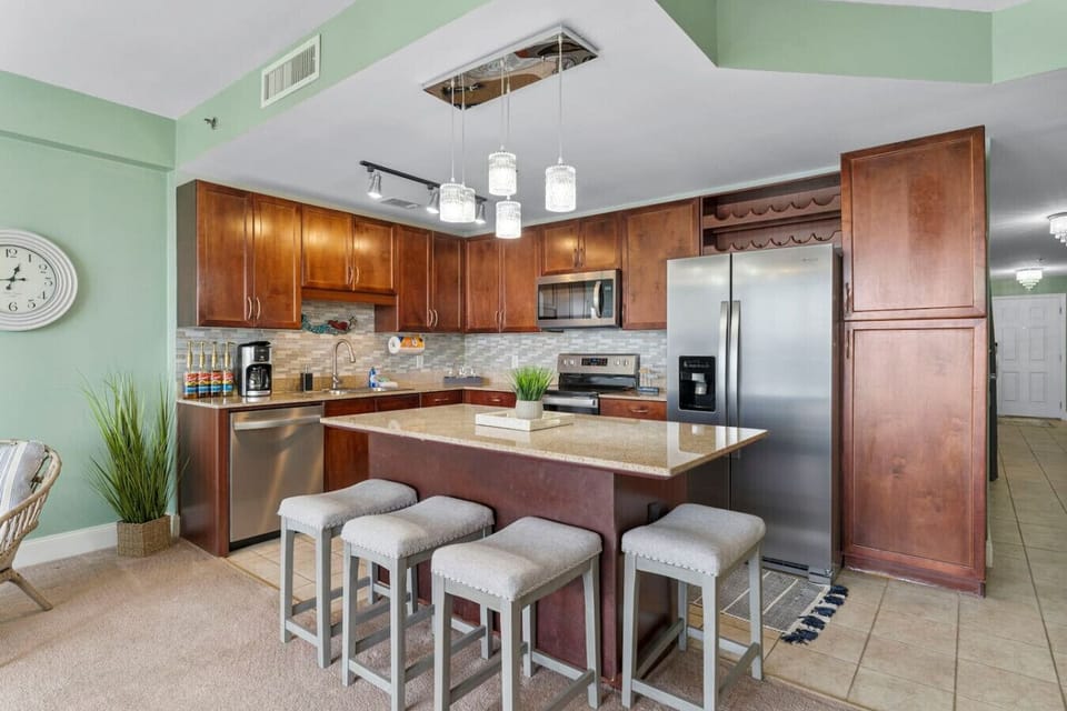 Fully Stocked Kitchen with Ocean Views, Island Bar Seating, Stainless Steel Appliances and Drip Coffee Maker