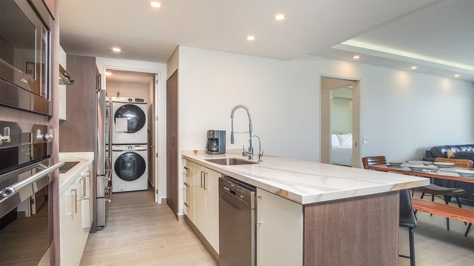 The kitchen is large and complete, with plenty of room to work. Attached is a separate utility room with a washer and dryer