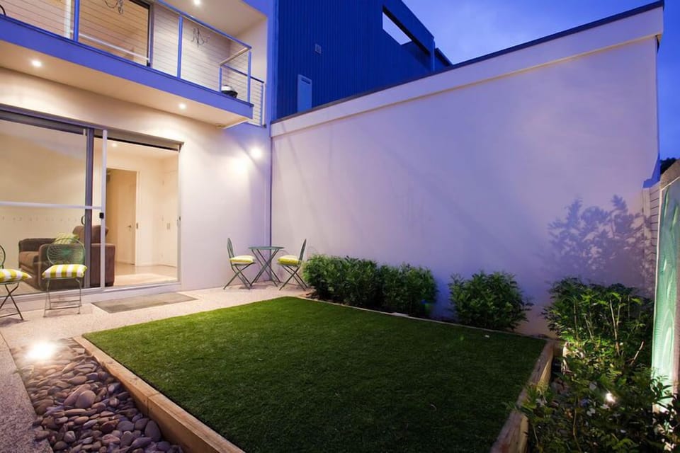 The private outdoor courtyard offers a secluded spot for sun-soaked relaxation