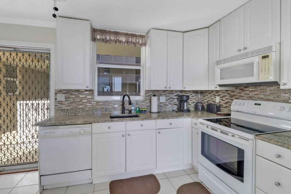 The kitchen comes well equipped with granite counters, full-size appliances, cookware, dinnerware and basic kitchen tools.