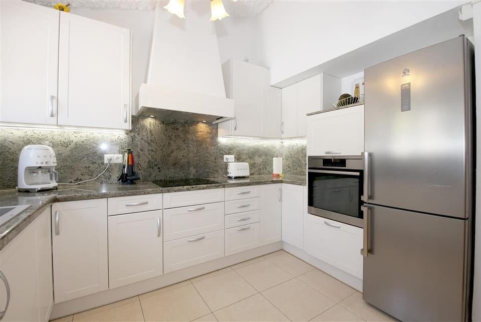 Modern kitchen is fully equipped with quality appliances