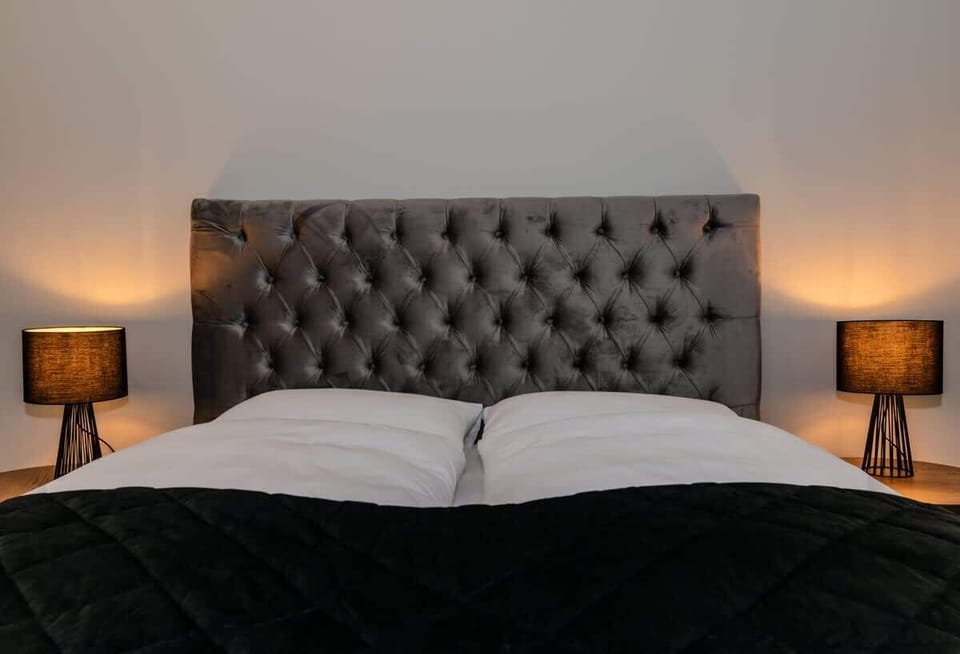 Bed in bedroom 1