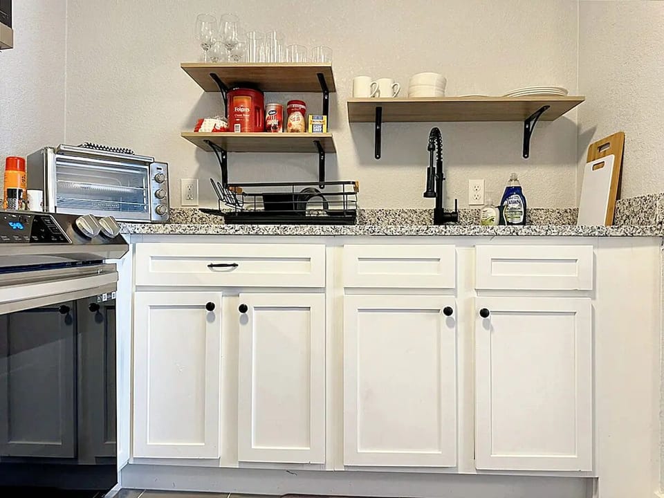 The kitchen is a perfect mix of convenience and style, designed for both novice cooks and pros