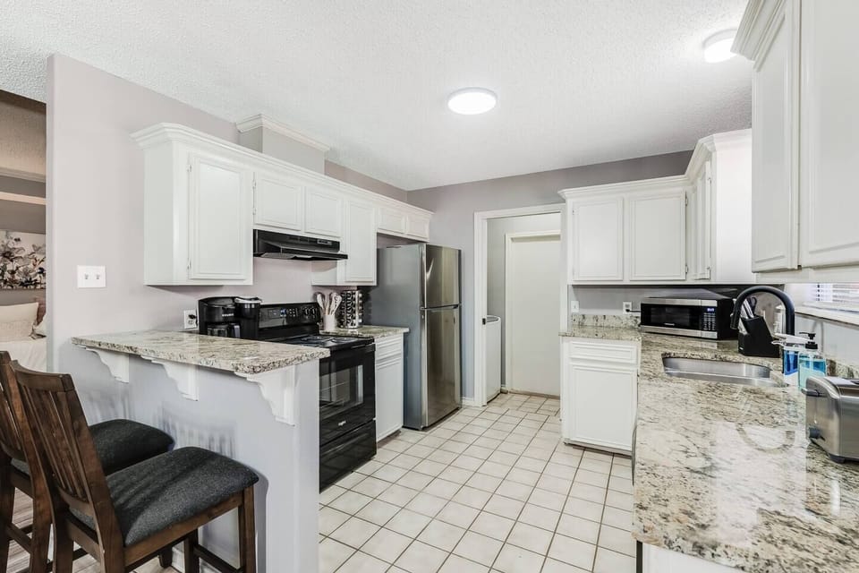 Enjoy cooking in this bright and contemporary kitchen space.