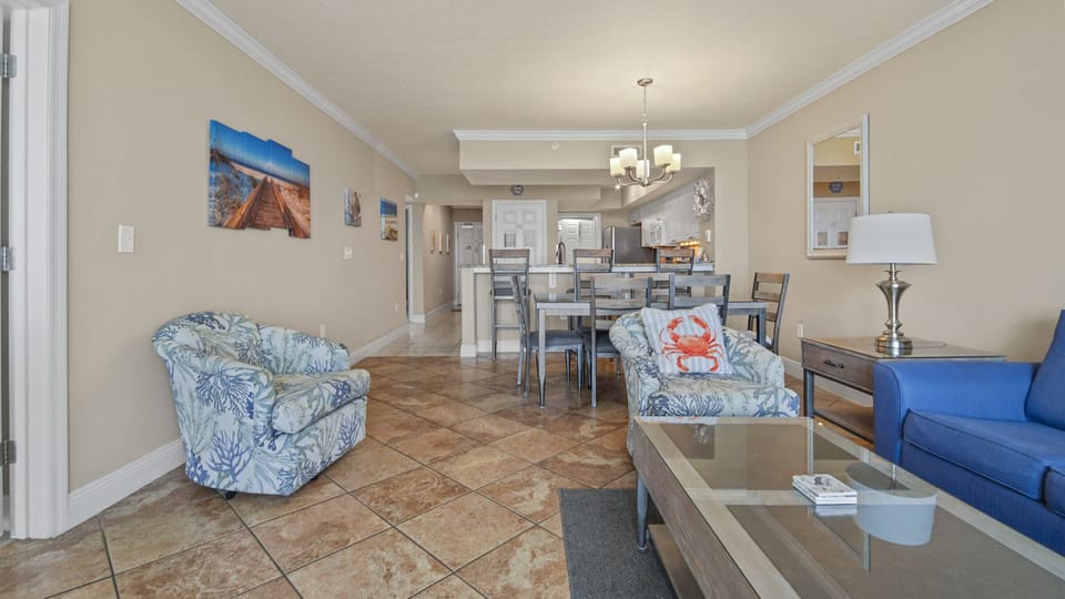 The living room offers ample, comfortable seating, a large flat screen television, and incredible views of the Gulf of Mexico.