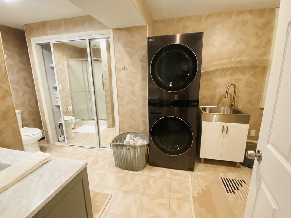 Lower level bathroom plus laundry tower