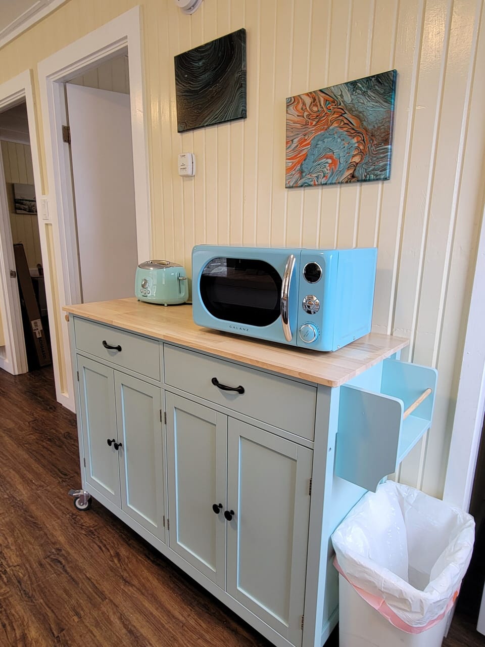 The kitchen cart provides additional storage.