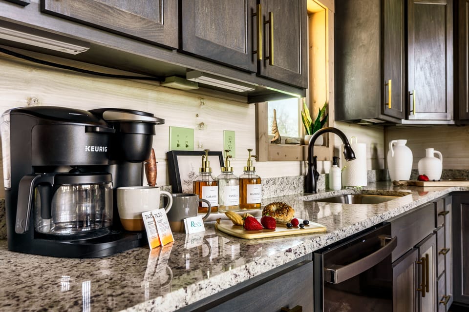 Coffee station providing k-kups, tea bags, coffee syrups and creamer pods.