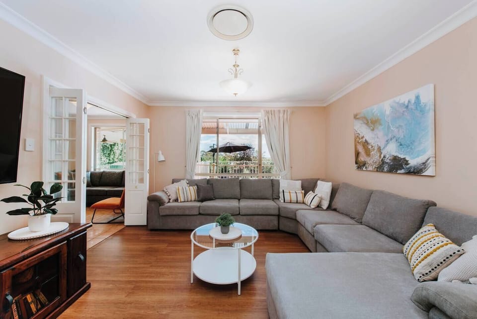 Stretch out on the enormous wrap-around chaise lounge and enjoy a good read or a movie on the wall-mounted HD TV.