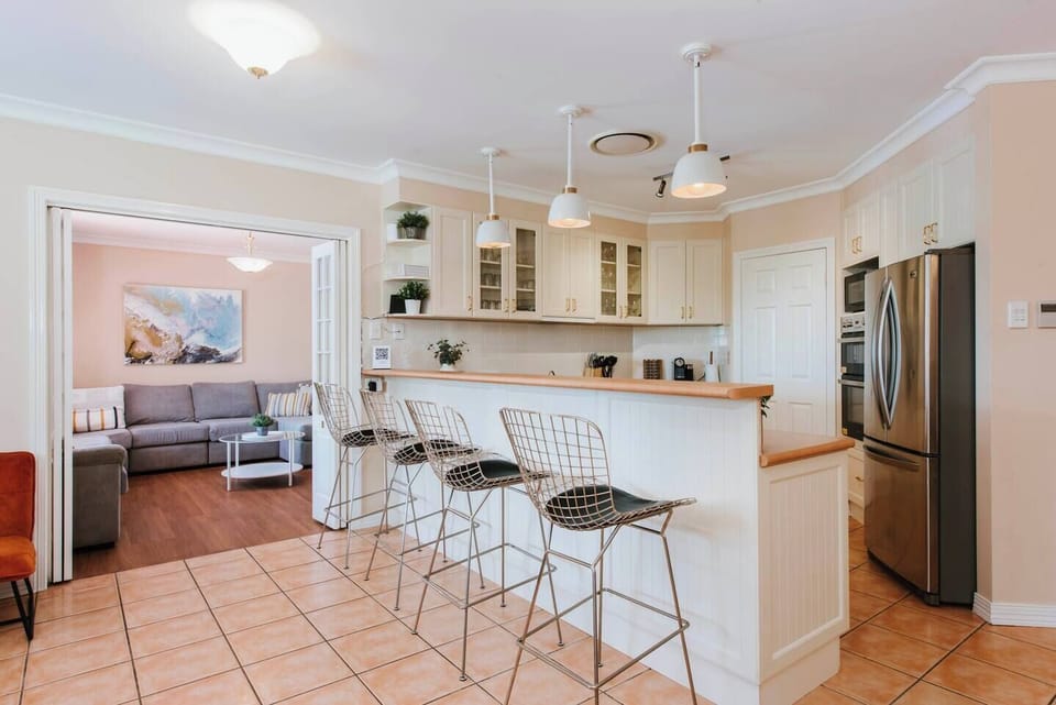 Cooking for the whole crew is a delight with the large kitchen providing ample bench space and storage featuring a walk-in pantry.