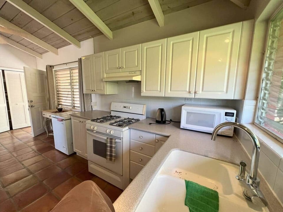 The image  provides a different angle of the upstairs kitchen, showing more of the layout and space.