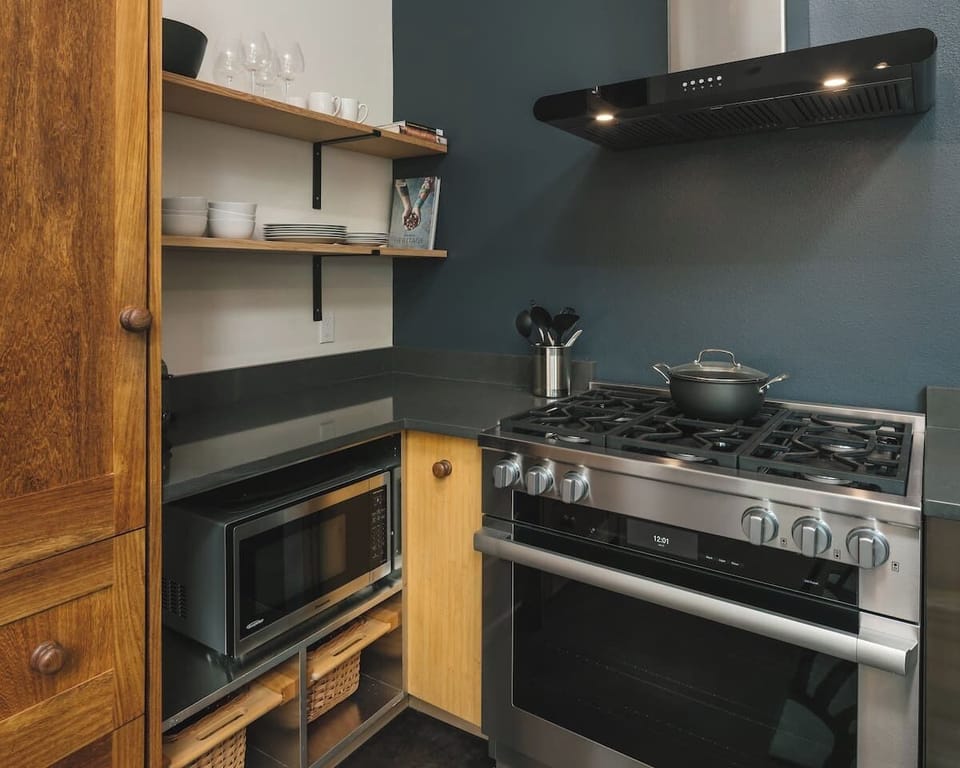 Kitchen: Cook up a storm in this stylish kitchen with modern appliances and ample storage!  Subzero fridge and Miele 36" range!