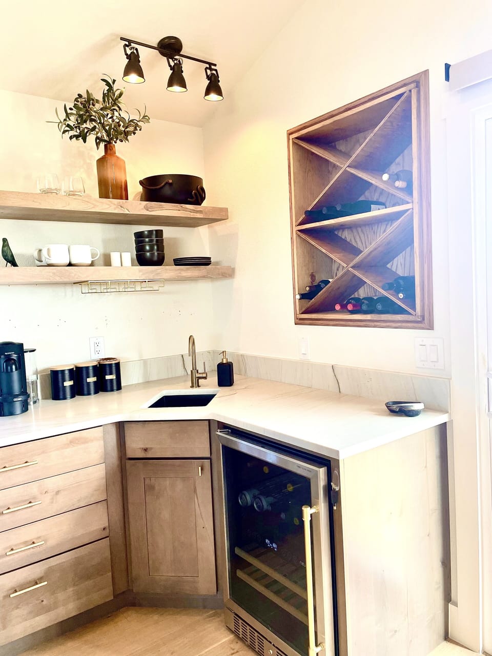 Upstairs kitchenette with mini-fridge and coffee maker.