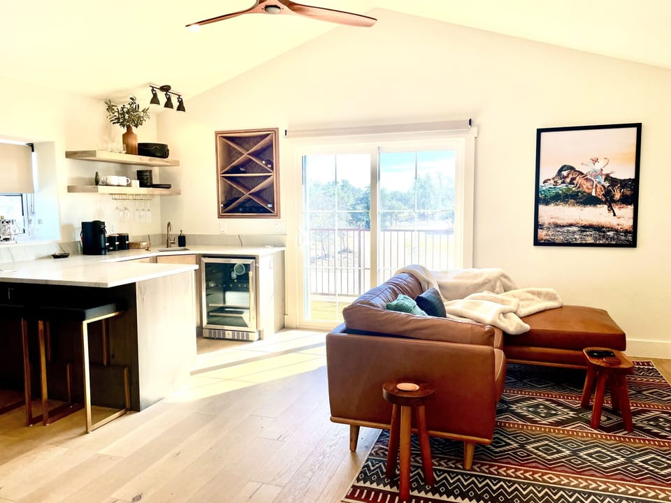 Upstairs loft living area, kitchenette, private deck and Murphy Bed.