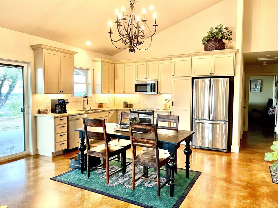 Spacious kitchen outfitted with quality cookware and serving dishes.