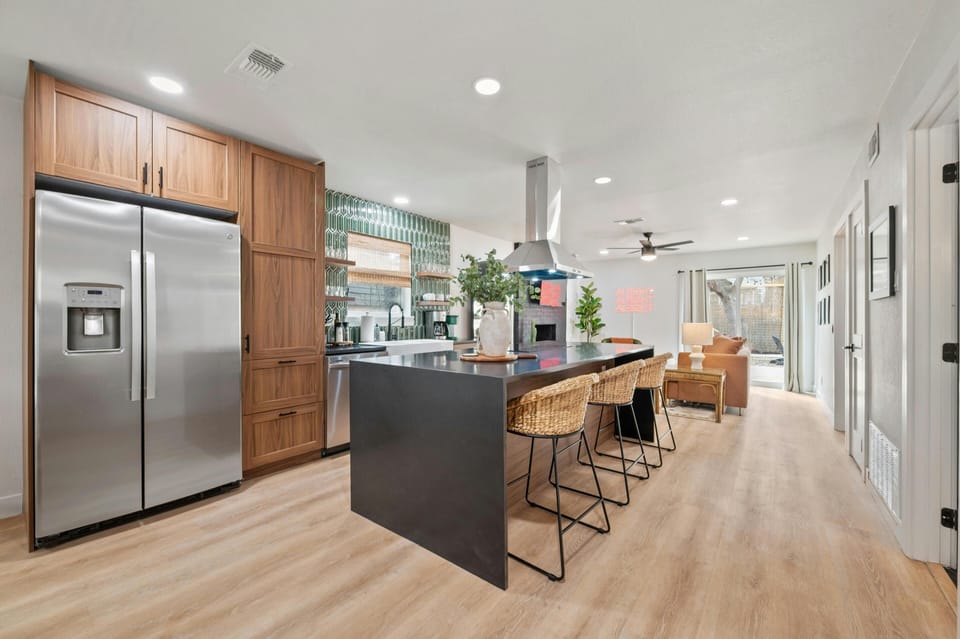 Open concept kitchen next to living room area, great area to cook,hangout, and watch a game/movie/show