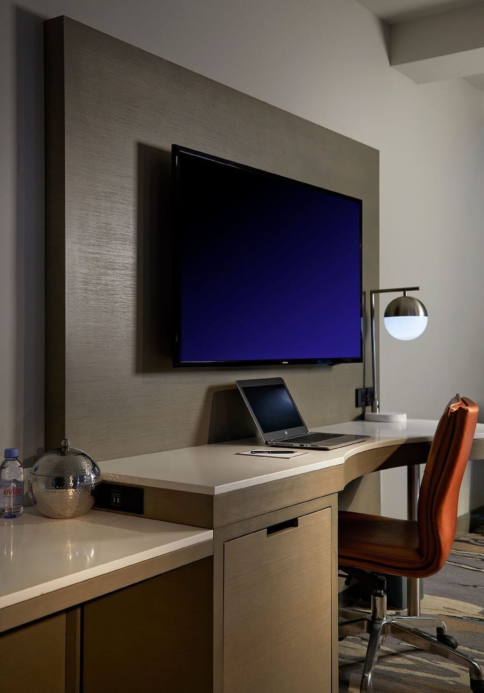Catch up on emails at a sleek desk and HDTV.