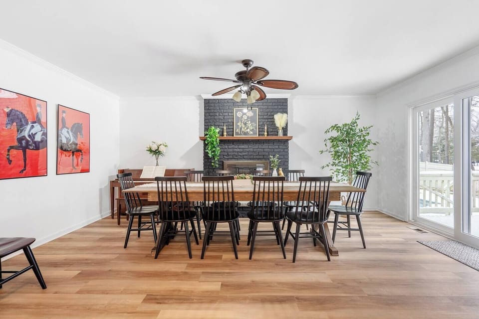 Our dining table set up with 10 chairs so everyone can eat. We painted our fireplace and love how it came out. You can see the beginning of two additional chairs on the left if you have a group of 12.
