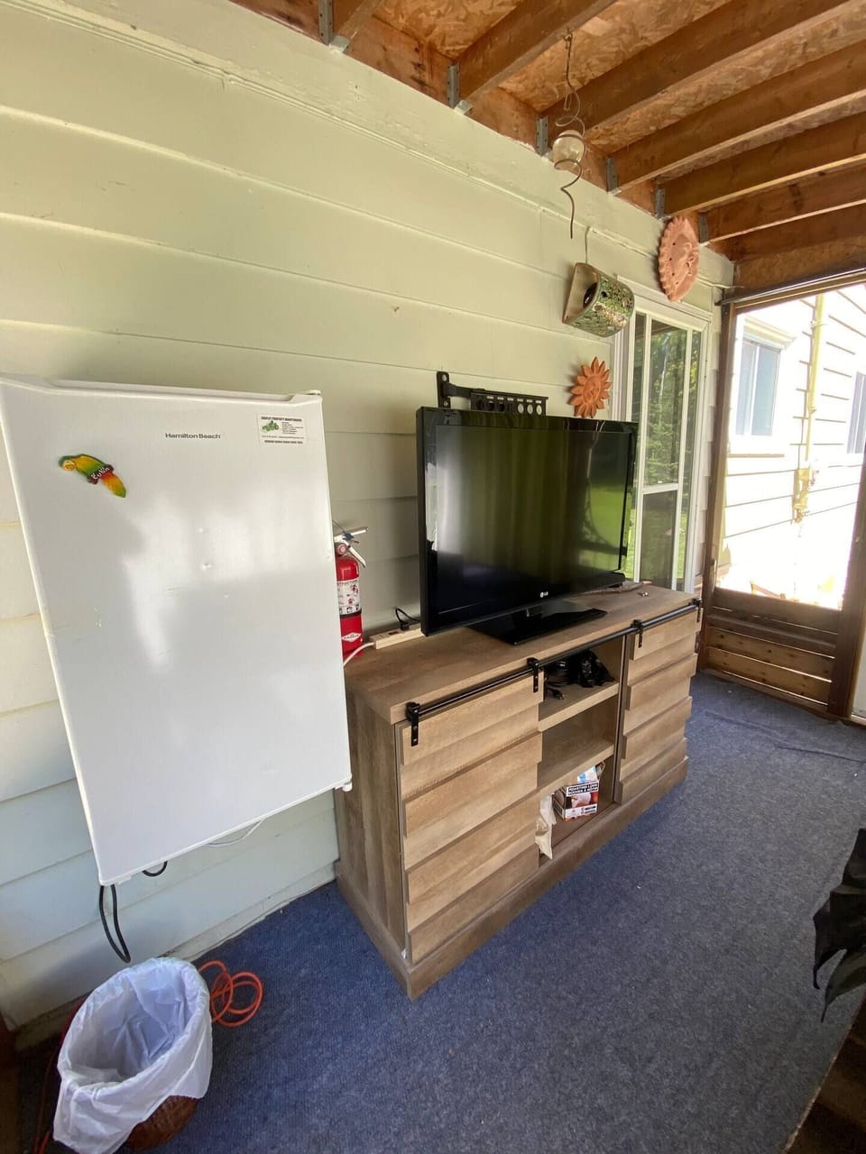 Indoor comfort meets outdoor vibes in the screened patio lounge with TV and mini fridge. Entertainment and snacks on hand!