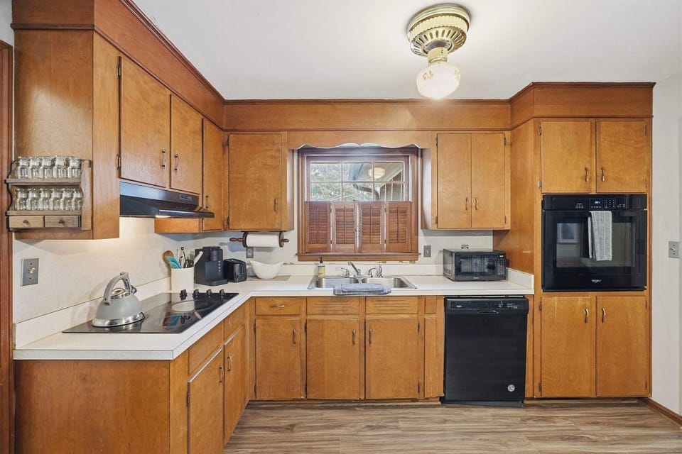Elevate your kitchen style with the timeless charm of wooden cabinets, where every countertop moment feels like home
