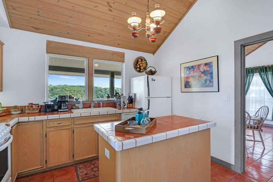 The kitchen is located behind the dining space