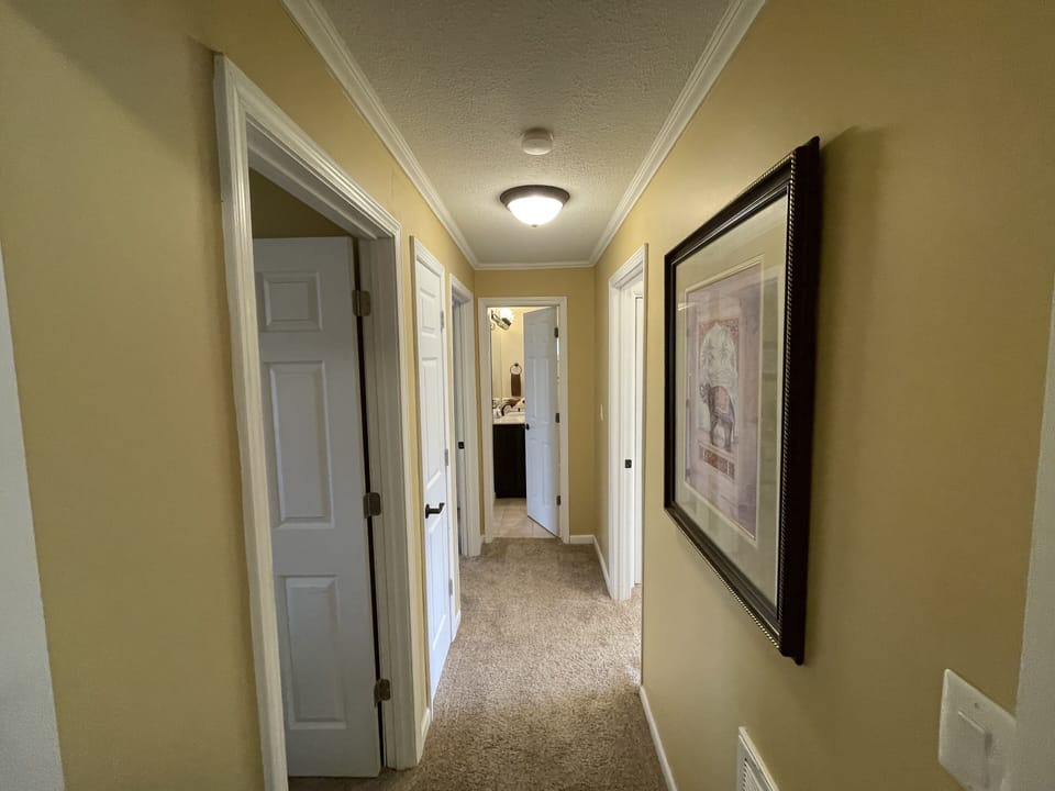Spacious hallway to the two guest suites. Makes certain both rooms are private