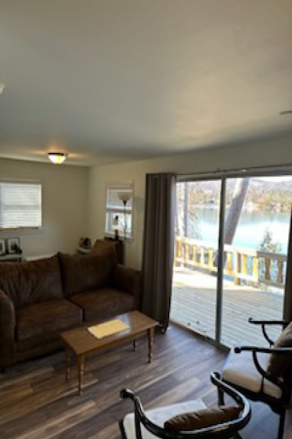 comfortable living room with a slider that leads out to the deck.