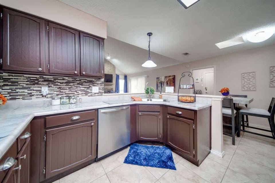 Fully equipped kitchen with modern appliances, ample counter space, and stylish finishes—perfect for cooking meals and gathering with family and friends