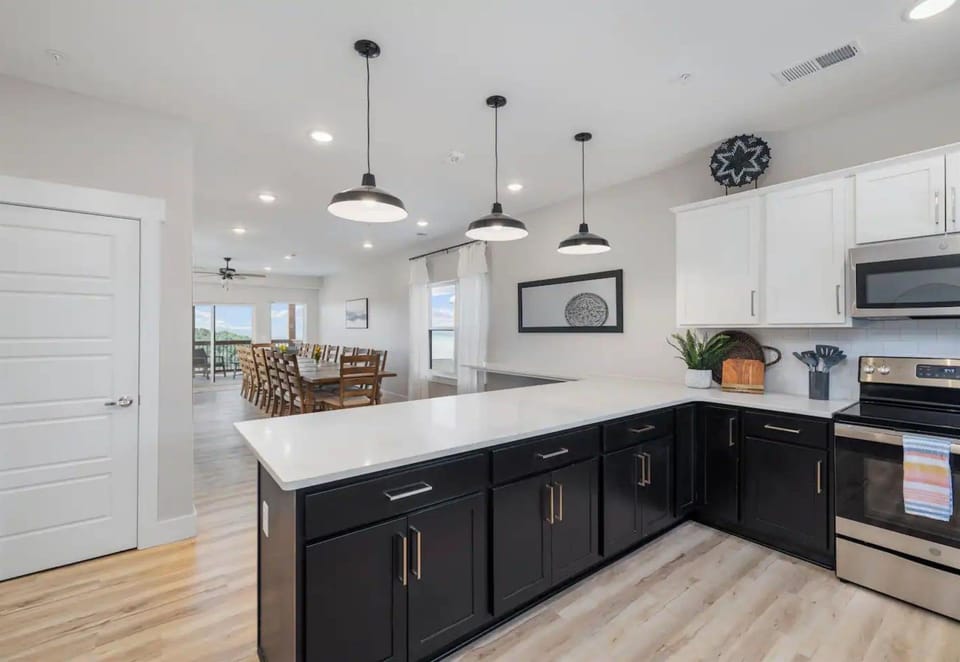Open and airy, this kitchen is designed for cooking and gathering, making it the heart of the home.