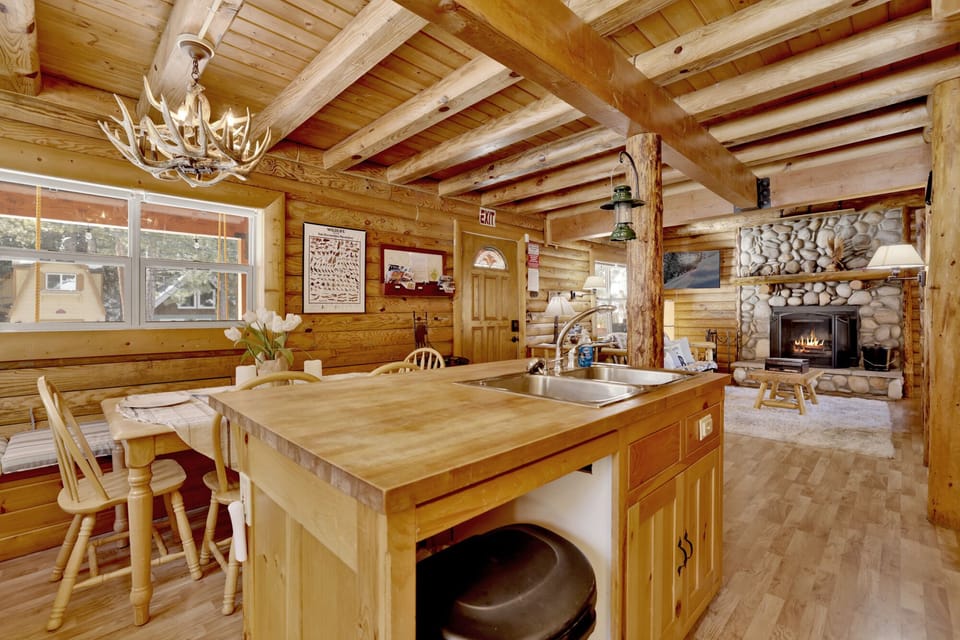 Fully equipped cabin kitchen with ample cabinetry, stove, fridge, microwave, and coffee maker—perfect for cooking meals, morning coffee, and feeling right at home on your stay.
