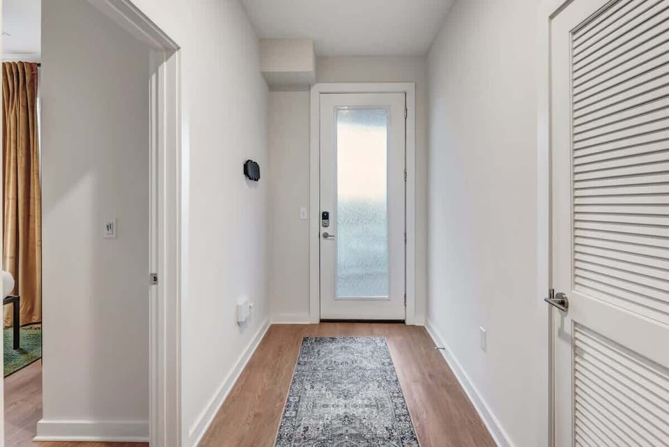 Step into a welcoming entryway that sets the tone for your stay, with clean lines and a stylish touch.