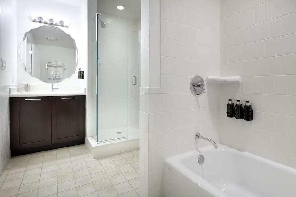 Refresh with a sleek glass shower and spa-bright vanity.